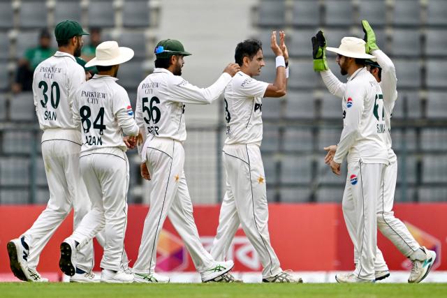 Pakistan’s Mohammad Abbas (3R) celebrates with teammates after taking the wicket of Bangladesh’s captain Najmul Hossain Shanto during the first day of the second Test cricket match between Bangladesh and Pakistan at the Sylhet International Cricket Stadium in Sylhet on May 16, 2026. (Photo by Munir UZ ZAMAN / AFP)