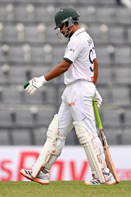 Bangladesh’s captain Najmul Hossain Shanto walks back to the pavilion after his dismissal by Pakistan’s Mohammad Abbas during the first day of the second Test cricket match between Bangladesh and Pakistan at the Sylhet International Cricket Stadium in Sylhet on May 16, 2026. (Photo by Munir UZ ZAMAN / AFP)