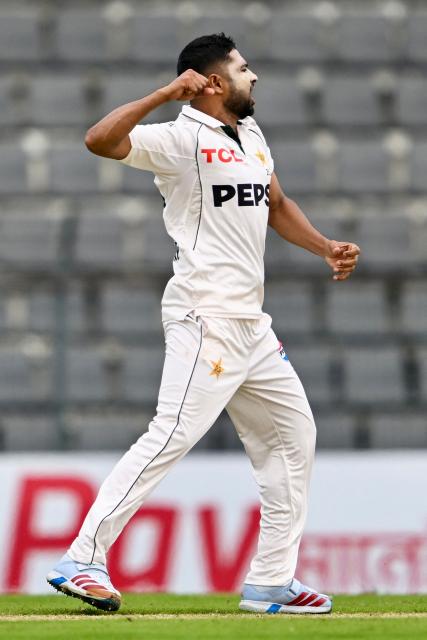Pakistan’s Khurram Shahzad celebrates after taking the wicket of Bangladesh’s Mushfiqur Rahim during the first day of the second Test cricket match between Bangladesh and Pakistan at the Sylhet International Cricket Stadium in Sylhet on May 16, 2026. (Photo by Munir UZ ZAMAN / AFP)