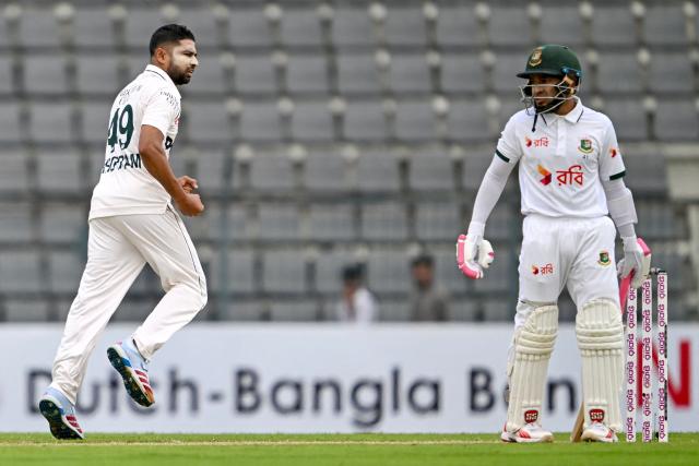 Pakistan’s Khurram Shahzad (L) celebrates after taking the wicket of Bangladesh’s Mushfiqur Rahim during the first day of the second Test cricket match between Bangladesh and Pakistan at the Sylhet International Cricket Stadium in Sylhet on May 16, 2026. (Photo by Munir UZ ZAMAN / AFP)
