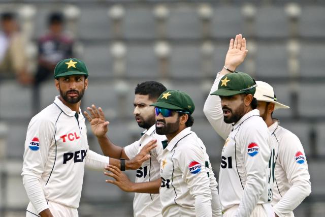 Pakistan’s Khurram Shahzad (2L) celebrates with teammates after taking the wicket of Bangladesh’s Mushfiqur Rahim during the first day of the second Test cricket match between Bangladesh and Pakistan at the Sylhet International Cricket Stadium in Sylhet on May 16, 2026. (Photo by Munir UZ ZAMAN / AFP)