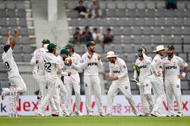 Pakistan’s players celebrate after the dismissal of Bangladesh’s Mushfiqur Rahim during the first day of the second Test cricket match between Bangladesh and Pakistan at the Sylhet International Cricket Stadium in Sylhet on May 16, 2026. (Photo by Munir UZ ZAMAN / AFP)