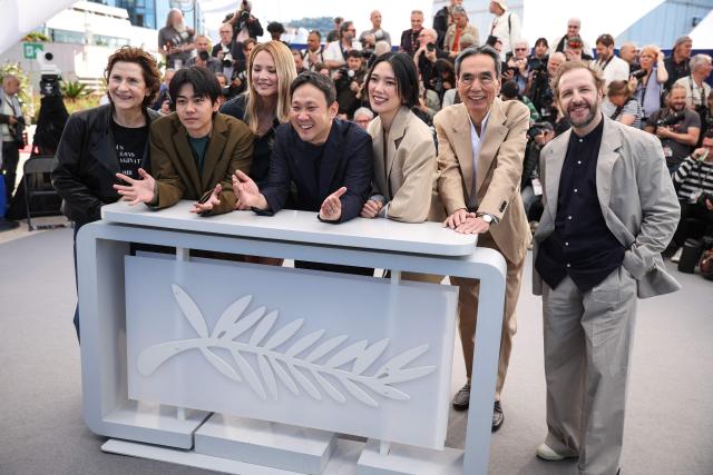 (From L) French actress Marie Bunel, Japanese Kodai Kurosaki, Belgian actress Virginie Efira, Japanese director and screenwriter Ryusuke Hamaguchi, Japanese actress Tao Okamoto, Japanese Kyozo Nagatsuka and French actor Jean-Charles Clichet pose during a photocall of the film "Soudain" (All of a Sudden) at the 79th edition of the Cannes Film Festival in Cannes, southern France on May 16, 2026. (Photo by Valery HACHE / AFP)