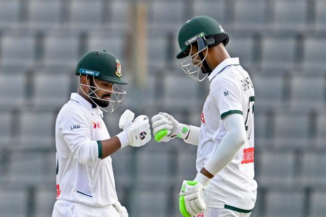 Bangladesh’s Litton Das (L) celebrates with teammate Shoriful Islam after scoring a century (100 runs) during the first day of the second Test cricket match between Bangladesh and Pakistan at the Sylhet International Cricket Stadium in Sylhet on May 16, 2026. (Photo by Munir UZ ZAMAN / AFP)