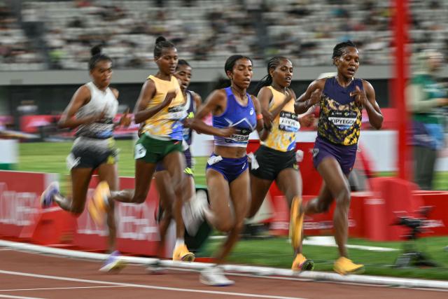 Kenya's Faith Kipyegon (R) competes in the women's 5000m event during the Shanghai/Keqiao Diamond League athletics meeting in Keqiao, Shaoxing in China's eastern Zhejiang province on May 16, 2026. (Photo by HECTOR RETAMAL / AFP)