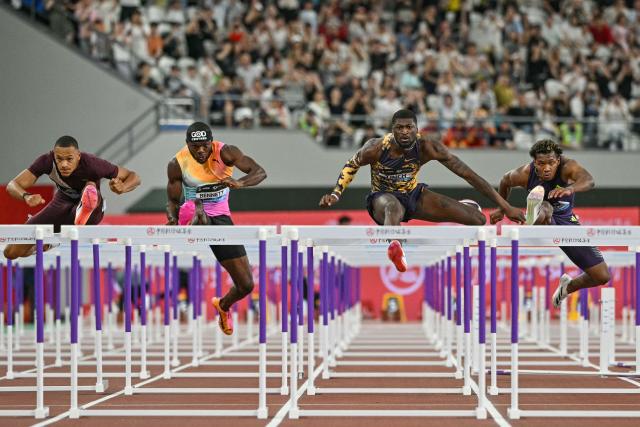 (L-R) USA's Jamal Britt, Jamaica's Orlando Bennett, USA's Cordell Tinch, and Japan's Rachid Muratake compete in the men's 110m hurdles event during the Shanghai/Keqiao Diamond League athletics meeting in Keqiao, Shaoxing in China's eastern Zhejiang province on May 16, 2026. (Photo by HECTOR RETAMAL / AFP)