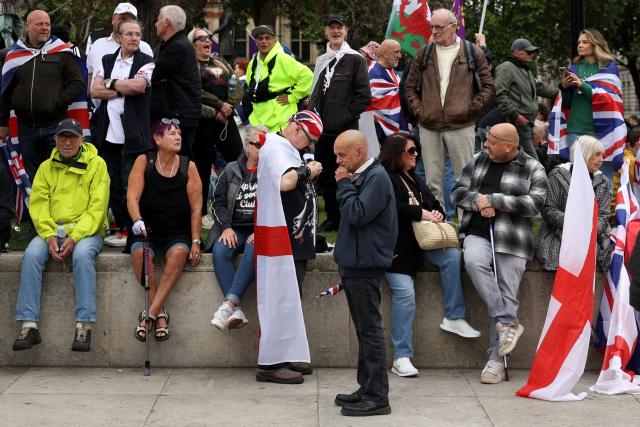 Supporters of British far-right activist Tommy Robinson, real name Stephen Yaxley-Lennon, arrive to listen to speeches in Parliament Square, in central London on May 16, 2026. (Photo by Toby Shepheard / AFP)