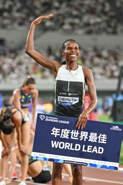 Uganda's Peruth Chemutai celebrates winning the women's 3000m steeplechase event during the Shanghai/Keqiao Diamond League athletics meeting in Keqiao, Shaoxing in China's eastern Zhejiang province on May 16, 2026. (Photo by HECTOR RETAMAL / AFP)