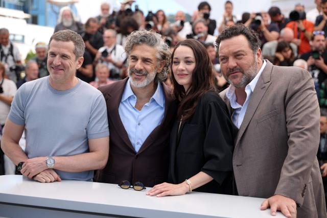 (From L) French director and screenwriter Guillaume Canet, Argentinian actor Leonardo Sbaraglia, French actress Marion Cotillard and French actor Denis Menochet pose during a photocall of the film "Karma" at the 79th edition of the Cannes Film Festival in Cannes, southern France on May 16, 2026. (Photo by Valery HACHE / AFP)