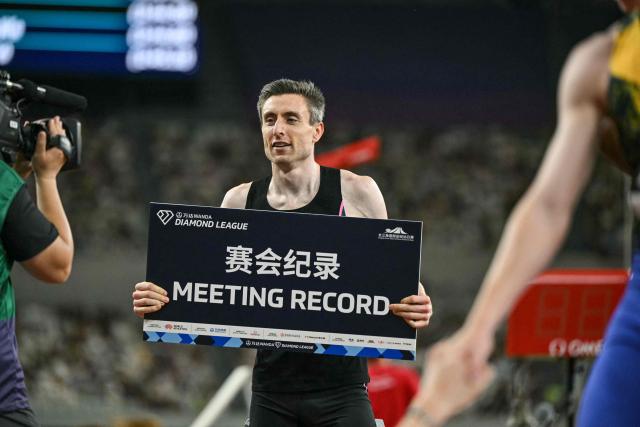 Ireland's Mark English celebrates winning the men's 800m event and breaking the meeting's record during the Shanghai/Keqiao Diamond League athletics meeting in Keqiao, Shaoxing in China's eastern Zhejiang province on May 16, 2026. (Photo by HECTOR RETAMAL / AFP)