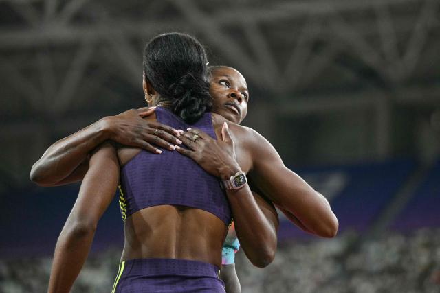 Jamaica's Shericka Jackson (R) celebrates winning the women's 200m event during the Shanghai/Keqiao Diamond League athletics meeting in Keqiao, Shaoxing in China's eastern Zhejiang province on May 16, 2026. (Photo by HECTOR RETAMAL / AFP)
