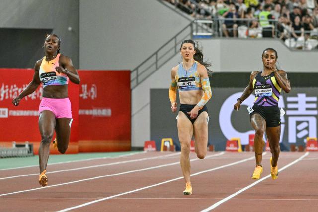 (L-R) Jamaica's Shericka Jackson, Britain's Amy Hunt, and USA's Sha'Carri Richardson compete in the women's 200m event during the Shanghai/Keqiao Diamond League athletics meeting in Keqiao, Shaoxing in China's eastern Zhejiang province on May 16, 2026. (Photo by HECTOR RETAMAL / AFP)