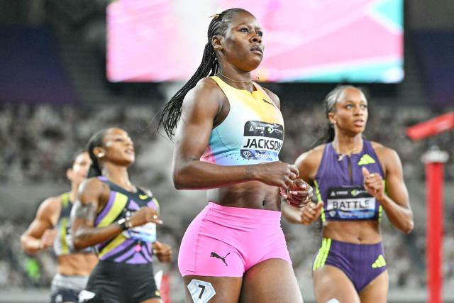 Jamaica's Shericka Jackson (C) celebrates winning the women's 200m event during the Shanghai/Keqiao Diamond League athletics meeting in Keqiao, Shaoxing in China's eastern Zhejiang province on May 16, 2026. (Photo by HECTOR RETAMAL / AFP)