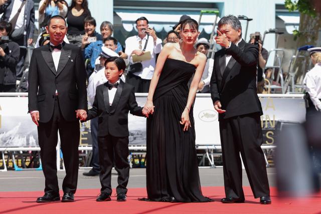 (From L) Japanese actor and comedian Daigo Yamamoto, Japanese actor Rimu Kuwaki, Japanese actress Haruka Ayase and Japanese director, producer, screenwriter and film editor Hirokazu Kore-Eda arrive for the screening of the film "Sheep in The Box" at the 79th edition of the Cannes Film Festival in Cannes, southern France on May 16, 2026. (Photo by Thibaud MORITZ / AFP)
