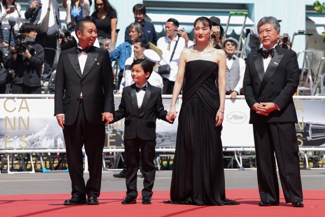 (From L) Japanese actor and comedian Daigo Yamamoto, Japanese actor Rimu Kuwaki, Japanese actress Haruka Ayase and Japanese director, producer, screenwriter and film editor Hirokazu Kore-Eda arrive for the screening of the film "Sheep in The Box" at the 79th edition of the Cannes Film Festival in Cannes, southern France on May 16, 2026. (Photo by Thibaud MORITZ / AFP)