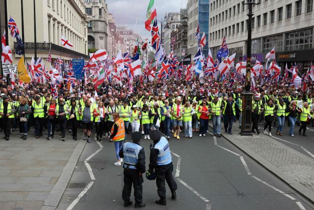 Supporters of British far-right activist Tommy Robinson, real name Stephen Yaxley-Lennon, take part in a march organised by United The Kingdom, in central London on May 16, 2026. (Photo by Toby Shepheard / AFP)