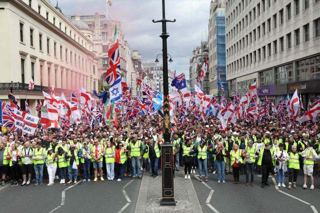 Supporters of British far-right activist Tommy Robinson, real name Stephen Yaxley-Lennon, take part in a march organised by United The Kingdom, in central London on May 16, 2026. (Photo by Toby Shepheard / AFP)