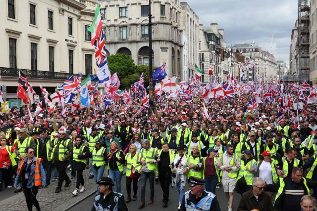 Supporters of British far-right activist Tommy Robinson, real name Stephen Yaxley-Lennon, take part in a march organised by United The Kingdom, in central London on May 16, 2026. (Photo by Toby Shepheard / AFP)