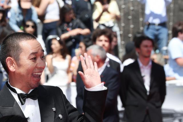 Japanese actor and comedian Daigo Yamamoto arrives for the screening of the film "Sheep in The Box" at the 79th edition of the Cannes Film Festival in Cannes, southern France on May 16, 2026. (Photo by Thibaud MORITZ / AFP)