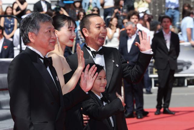 (From R) Japanese actor and comedian Daigo Yamamoto, Japanese actor Rimu Kuwaki, Japanese actress Haruka Ayase and Japanese actor Hirokazu Koreeda arrive for the screening of the film "Sheep in The Box" at the 79th edition of the Cannes Film Festival in Cannes, southern France on May 16, 2026. (Photo by Thibaud MORITZ / AFP)