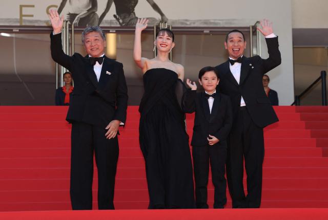 (From L) Japanese actor Hirokazu Koreeda, Japanese actress Haruka Ayase, Japanese actor Rimu Kuwaki and Japanese actor and comedian Daigo Yamamoto arrive for the screening of the film "Sheep in The Box" at the 79th edition of the Cannes Film Festival in Cannes, southern France on May 16, 2026. (Photo by Thibaud MORITZ / AFP)