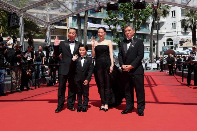 (From L) Japanese actor and comedian Daigo Yamamoto, Japanese actor Rimu Kuwaki, Japanese actress Haruka Ayase and Japanese film director, producer, screenplay writer and film editor Hirokazu Kore-Eda arrive for the screening of the film "Sheep in The Box" at the 79th edition of the Cannes Film Festival in Cannes, southern France on May 16, 2026. (Photo by Thibaud MORITZ / AFP)