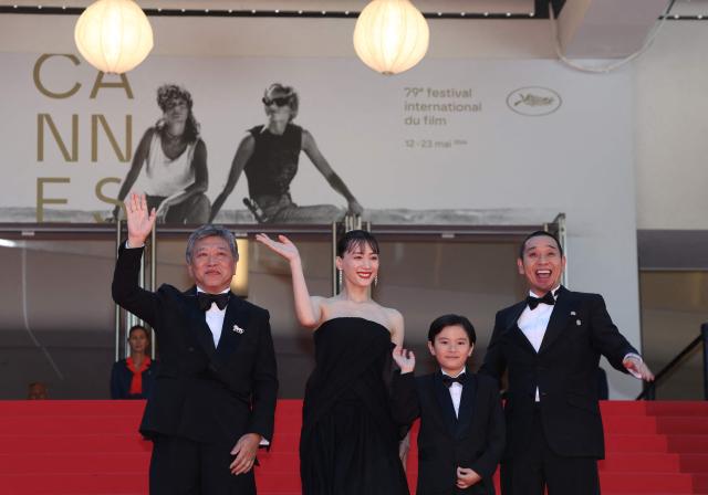 (From L) Japanese actor Hirokazu Koreeda, Japanese actress Haruka Ayase, Japanese actor Rimu Kuwaki and Japanese actor and comedian Daigo Yamamoto arrive for the screening of the film "Sheep in The Box" at the 79th edition of the Cannes Film Festival in Cannes, southern France on May 16, 2026. (Photo by Thibaud MORITZ / AFP)