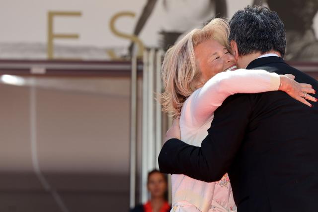 President of the Cannes Film Festival Iris Knobloch (L) greets Japanese director and screenwriter Hirokazu Kore-eda as he arrives for the screening of the film "Sheep in The Box" at the 79th edition of the Cannes Film Festival in Cannes, southern France on May 16, 2026. (Photo by Thibaud MORITZ / AFP)