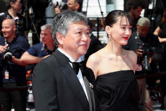Japanese director and screenwriter Hirokazu Kore-eda and Japanese actress Haruka Ayase arrive for the screening of the film "Sheep in The Box" at the 79th edition of the Cannes Film Festival in Cannes, southern France on May 16, 2026. (Photo by Thibaud MORITZ / AFP)