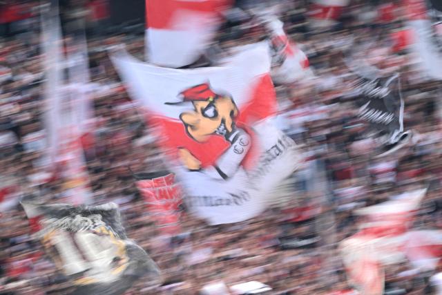 Fans cheer for their team prior to the start of the German first division Bundesliga football match between Eintracht Frankfurt and VfB Stuttgart in Frankfurt am Main, western Germany, on May 16, 2026. (Photo by Kirill KUDRYAVTSEV / AFP) / DFL REGULATIONS PROHIBIT ANY USE OF PHOTOGRAPHS AS IMAGE SEQUENCES AND/OR QUASI-VIDEO
