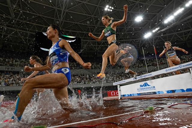 Athletes compete in the women's 3000m steeplechase event during the Shanghai/Keqiao Diamond League athletics meeting in Keqiao, Shaoxing in China's eastern Zhejiang province on May 16, 2026. (Photo by WANG Zhao / AFP)