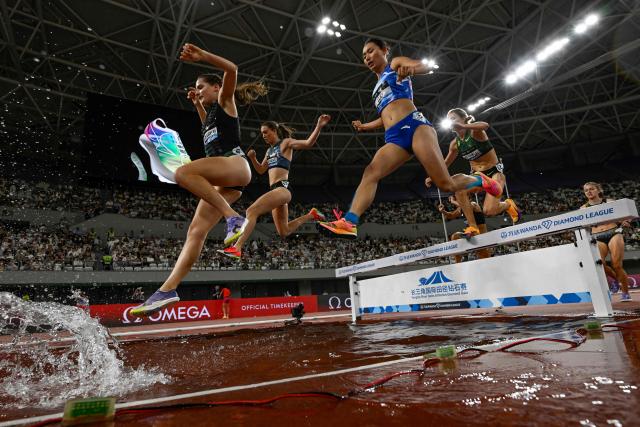 Athletes compete in the women's 3000m steeplechase event during the Shanghai/Keqiao Diamond League athletics meeting in Keqiao, Shaoxing in China's eastern Zhejiang province on May 16, 2026. (Photo by WANG Zhao / AFP)
