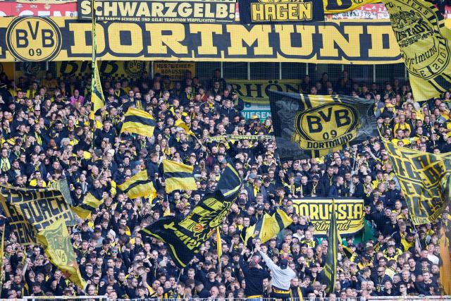 Dortmund's fans cheer their team prior the German first division Bundesliga football match between Werder Bremen and Borussia Dortmund in Bremen, northwestern Germany, on May 16, 2026. (Photo by Focke Strangmann / AFP) / DFL REGULATIONS PROHIBIT ANY USE OF PHOTOGRAPHS AS IMAGE SEQUENCES AND/OR QUASI-VIDEO