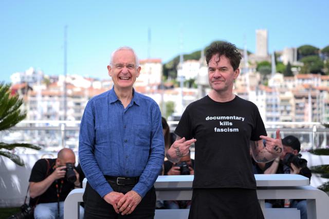 British producer John Archer and British director Mark Cousins pose during a photocall of the film "The Story Of Documentary Film (The 1970s)" at the 79th edition of the Cannes Film Festival in Cannes, southern France on May 16, 2026. (Photo by Olivier CHASSIGNOLE / AFP)