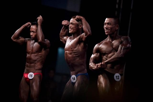 Bodybuilders compete in the 20th South East Asian Championships 2026 at the Myanmar Convention Center in Yangon on May 16, 2026. (Photo by Sai Aung MAIN / AFP)
