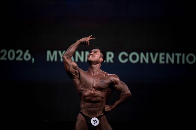 A bodybuilder competes in the 20th South East Asian Championships 2026 at the Myanmar Convention Center in Yangon on May 16, 2026. (Photo by Sai Aung MAIN / AFP)