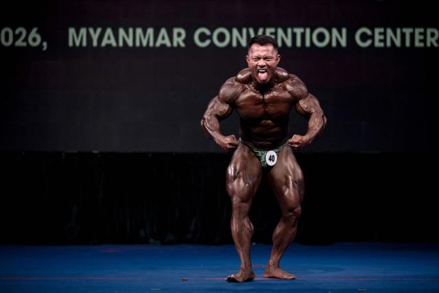 A bodybuilder competes in the 20th South East Asian Championships 2026 at the Myanmar Convention Center in Yangon on May 16, 2026. (Photo by Sai Aung MAIN / AFP)