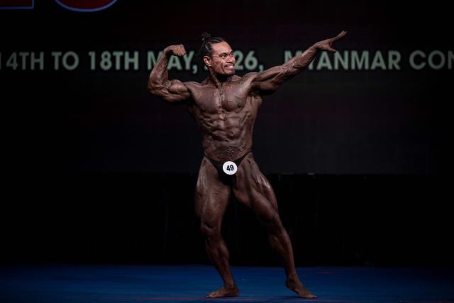A bodybuilder competes in the 20th South East Asian Championships 2026 at the Myanmar Convention Center in Yangon on May 16, 2026. (Photo by Sai Aung MAIN / AFP)