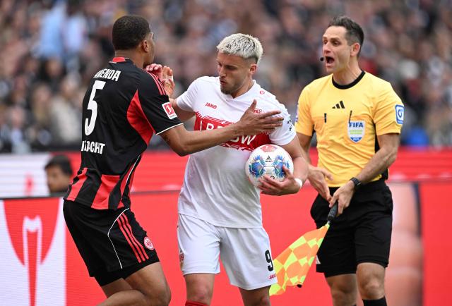 Frankfurt's Swiss defender #05 Aurele Amenda (L) and Stuttgart's Bosnian forward #09 Ermedin Demirovic (C) argue during the German first division Bundesliga football match between Eintracht Frankfurt and VfB Stuttgart in Frankfurt am Main, western Germany, on May 16, 2026. (Photo by Kirill KUDRYAVTSEV / AFP) / DFL REGULATIONS PROHIBIT ANY USE OF PHOTOGRAPHS AS IMAGE SEQUENCES AND/OR QUASI-VIDEO