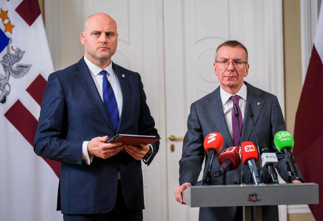 Latvia's President Edgars Rinkevics (R) announces that he asked Andris Kulbergs (L) to form a new cabinet of ministers after he met with all factions of the Saeima, Latvia's parliament, on May 16, 2026 in Riga, Latvia. Latvia's Prime Minister Evika Silina had resigned on May 14, 2026 over her government's handling of Ukrainian drones that strayed into Latvian territory during attacks in Russia. (Photo by Gints Ivuskans and AFP / AFP)