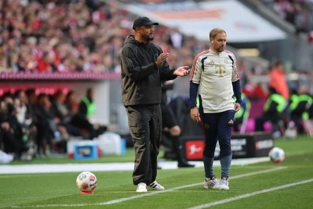 Bayern Munich's Belgian head coach Vincent Kompany (L) and FC Bayern Munich's English assistant coach Aaron Danks are seen on the sidelines during the German first division Bundesliga football match between FC Bayern Munich and FC Cologne in Munich, southern Germany, on May 16, 2026. (Photo by Alexandra BEIER / AFP) / DFL REGULATIONS PROHIBIT ANY USE OF PHOTOGRAPHS AS IMAGE SEQUENCES AND/OR QUASI-VIDEO