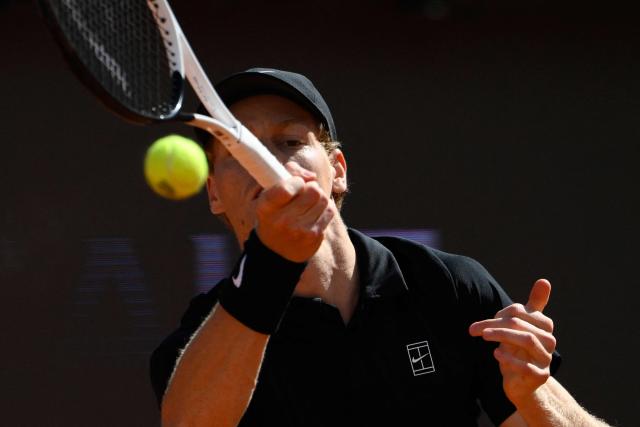 Italy's Jannik Sinner hits a return to Russia's Daniil Medvedev during their semi-final, that was delayed yesterday due to rainfall, at the ATP Rome Open tennis tournament at Foro Italico in Rome on May 16, 2026. (Photo by Tiziana FABI / AFP)