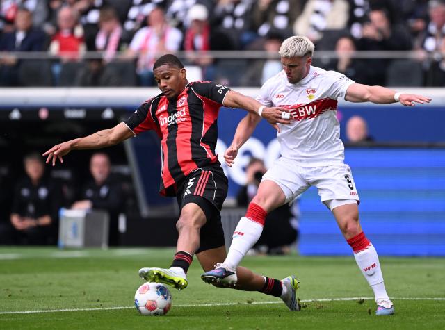 Frankfurt's Swiss defender #05 Aurele Amenda (L) and Stuttgart's Bosnian forward #09 Ermedin Demirovic vie for the ball during the German first division Bundesliga football match between Eintracht Frankfurt and VfB Stuttgart in Frankfurt am Main, western Germany, on May 16, 2026. (Photo by Kirill KUDRYAVTSEV / AFP) / DFL REGULATIONS PROHIBIT ANY USE OF PHOTOGRAPHS AS IMAGE SEQUENCES AND/OR QUASI-VIDEO