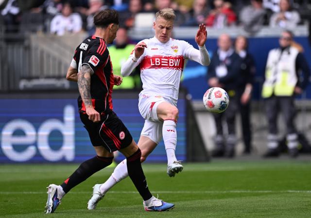 Stuttgart's German midfielder #10 Chris Fuehrich (R) and Frankfurt's German defender #04 Robin Koch vie for the ball during the German first division Bundesliga football match between Eintracht Frankfurt and VfB Stuttgart in Frankfurt am Main, western Germany, on May 16, 2026. (Photo by Kirill KUDRYAVTSEV / AFP) / DFL REGULATIONS PROHIBIT ANY USE OF PHOTOGRAPHS AS IMAGE SEQUENCES AND/OR QUASI-VIDEO