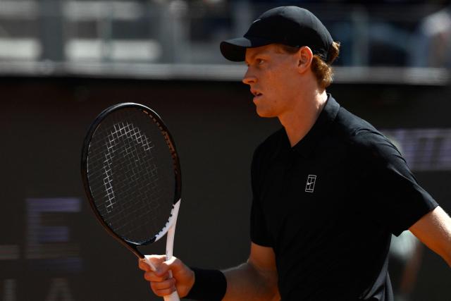Italy's Jannik Sinner celebrates a point against Russia's Daniil Medvedev during their semi-final, which was delayed yesterday due to rainfall, at the ATP Rome Open tennis tournament at Foro Italico in Rome on May 16, 2026. (Photo by Tiziana FABI / AFP)