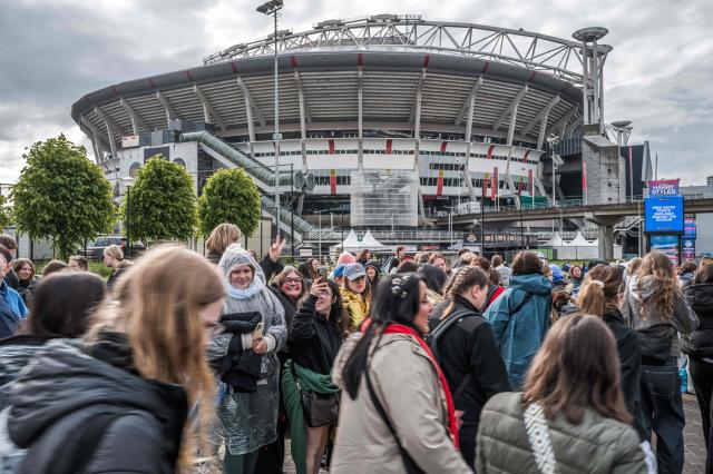 Fans of British singer Harry Styles await outside the Johan Cruijff ArenA, ahead of his ten-day concert series and his world tour Together, Together Tour in Amsterdam on May 16, 2026. Ten years after One Direction split up, British singer Harry Styles, who is setting off on tour this May 16, 2026, in Amsterdam with his fourth album, has established himself as one of the world’s biggest pop stars, thanks to his stage presence and his embodiment of a new form of masculinity. (Photo by Joris van Gennip / ANP / AFP) / Netherlands OUT
