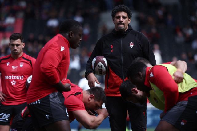 Lyon's French head coach Karim Ghezal attends a warm up session ahead of the French Top14 rugby union match between Lyon Olympique Universitaire Rugby and Aviron Bayonnais (Bayonne) at the Gerland Stadium in Lyon, central-eastern France on May 16, 2026. (Photo by Alex MARTIN / AFP)