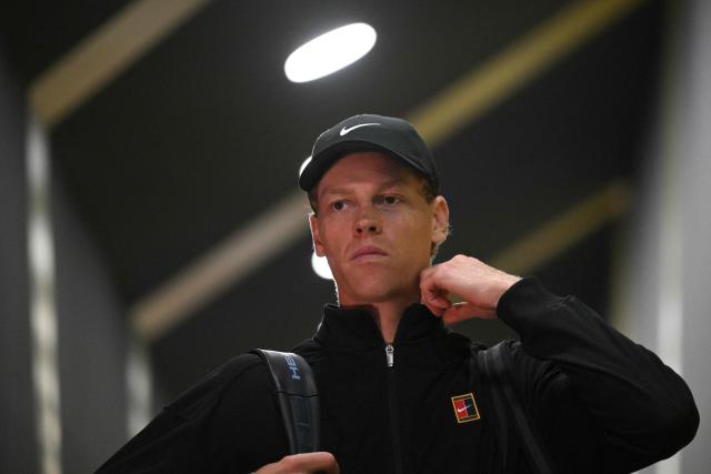 Italy's Jannik Sinner arrives for the end of the semi-final against Russia's Daniil Medvedev, which was postponed due to bad weather, at the ATP Rome Open tennis tournament at Foro Italico in Rome on May 16, 2026. (Photo by Tiziana FABI / AFP)