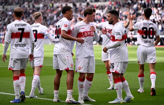(L-R) Stuttgart's German defender #07 Maximilian Mittelstaedt, Stuttgart's German midfielder #10 Chris Fuehrich, Stuttgart's Danish midfielder #28 Nikolas Nartey, Stuttgart's German midfielder #06 Angelo Stiller, Stuttgart's German forward #26 Deniz Undav and Stuttgart's Spanish midfielder #30 Chema Andres celebrate after scoring the 0-2 goal during the German first division Bundesliga football match between Eintracht Frankfurt and VfB Stuttgart in Frankfurt am Main, western Germany, on May 16, 2026. (Photo by Kirill KUDRYAVTSEV / AFP) / DFL REGULATIONS PROHIBIT ANY USE OF PHOTOGRAPHS AS IMAGE SEQUENCES AND/OR QUASI-VIDEO