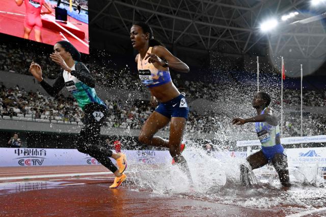 Kenya's Faith Cherotich (C)  competes in the women's 3000m steeplechase event during the Shanghai/Keqiao Diamond League athletics meeting in Keqiao, Shaoxing in China's eastern Zhejiang province on May 16, 2026. (Photo by WANG Zhao / AFP)